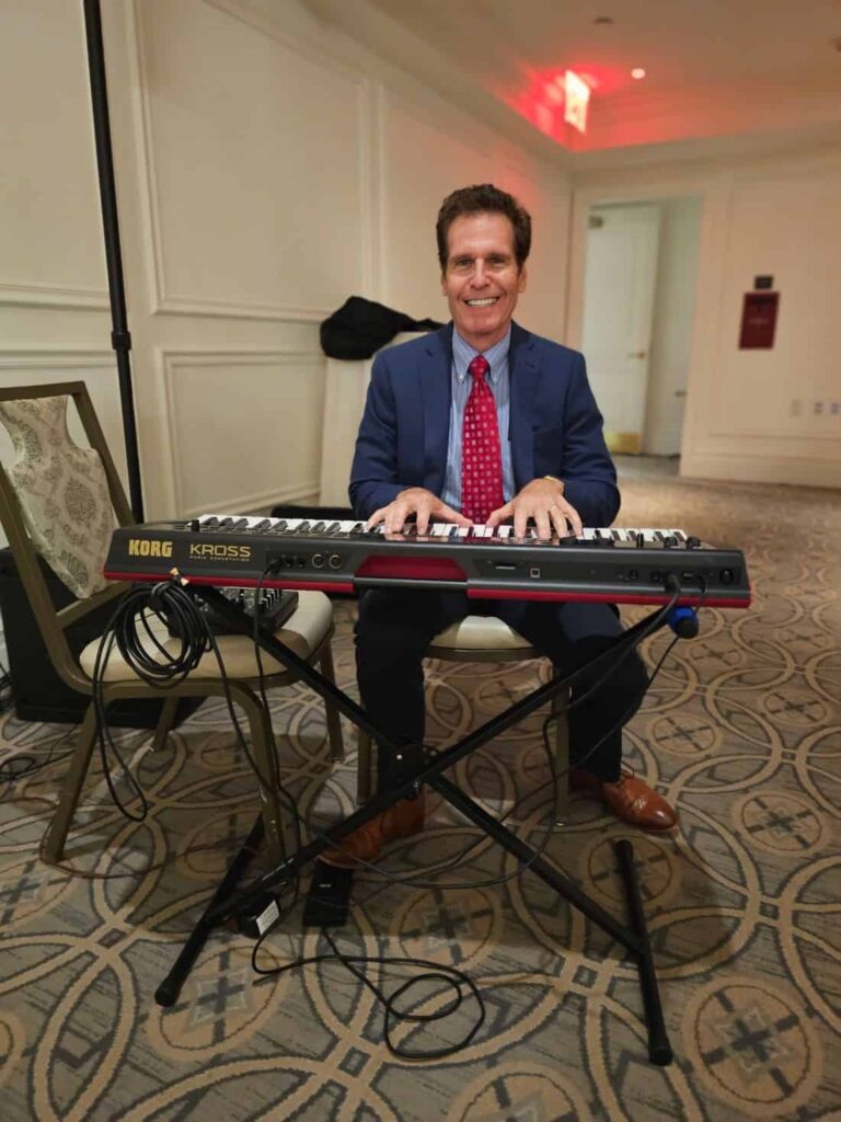 New York City pianist Arnie Abrams performing at the International Precious Metals Institute Platinum Dinner - smaller