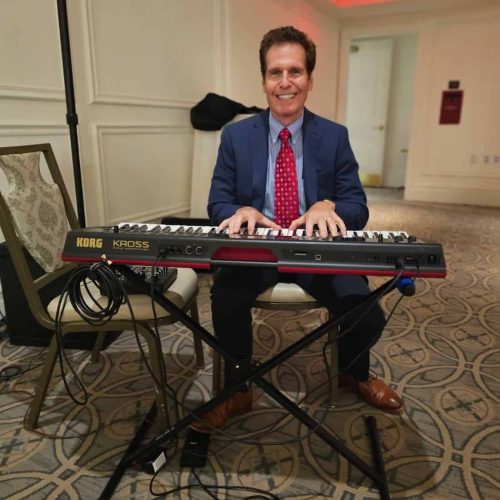 New York City pianist Arnie Abrams performing at the International Precious Metals Institute Platinum Dinner - smaller